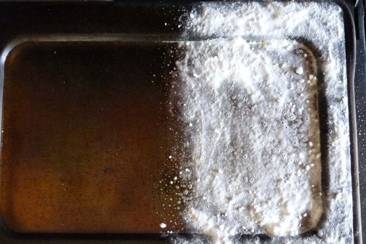 4 Ways To Finally Get That Burnt Grease Off Your Baking Sheet Without Scrubbing All Day